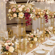 Gold metal floral risers holding elaborate floral arrangements at a wedding reception - thumbnail number 3