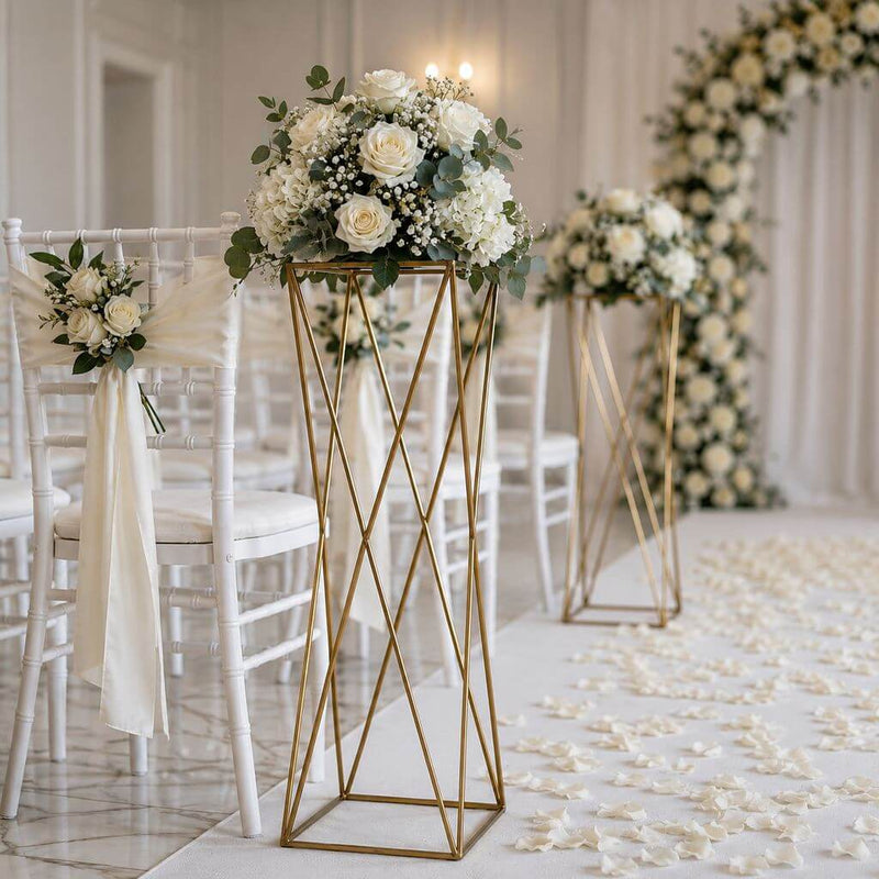 Gold geometric pedestals with floral centerpieces in wedding aisle - thumbnail number 2