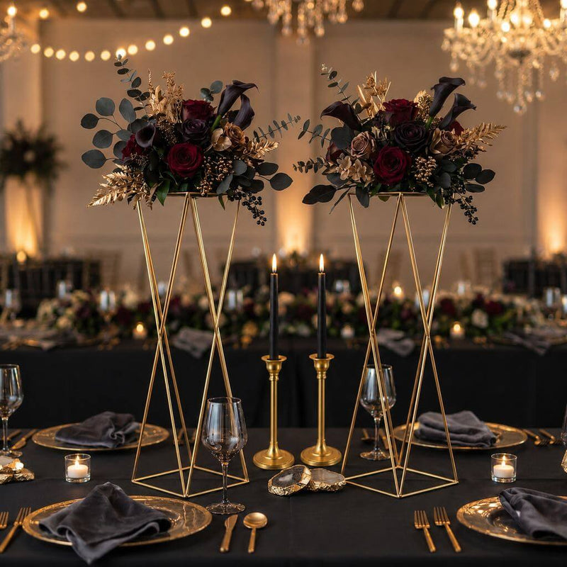 Gold geometric stands with dark floral wedding centerpieces on black table - thumbnail number 4