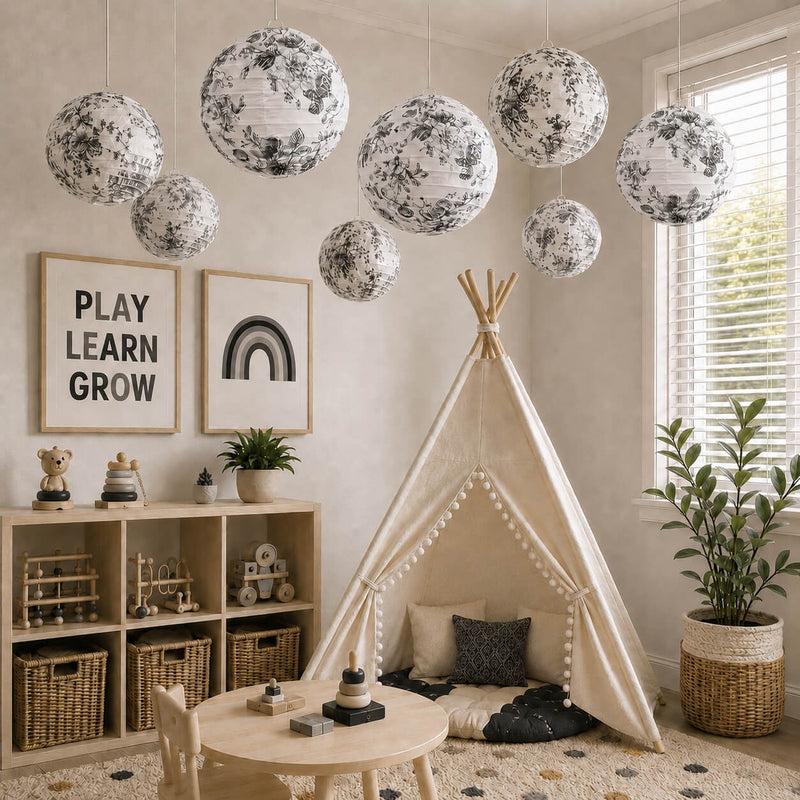 Black and white French toile paper lanterns hanging in a nursery - thumbnail number 10