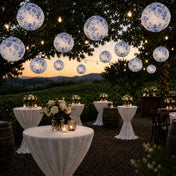 Blue floral paper lanterns hang over an outdoor winery cocktail event - thumbnail number 6