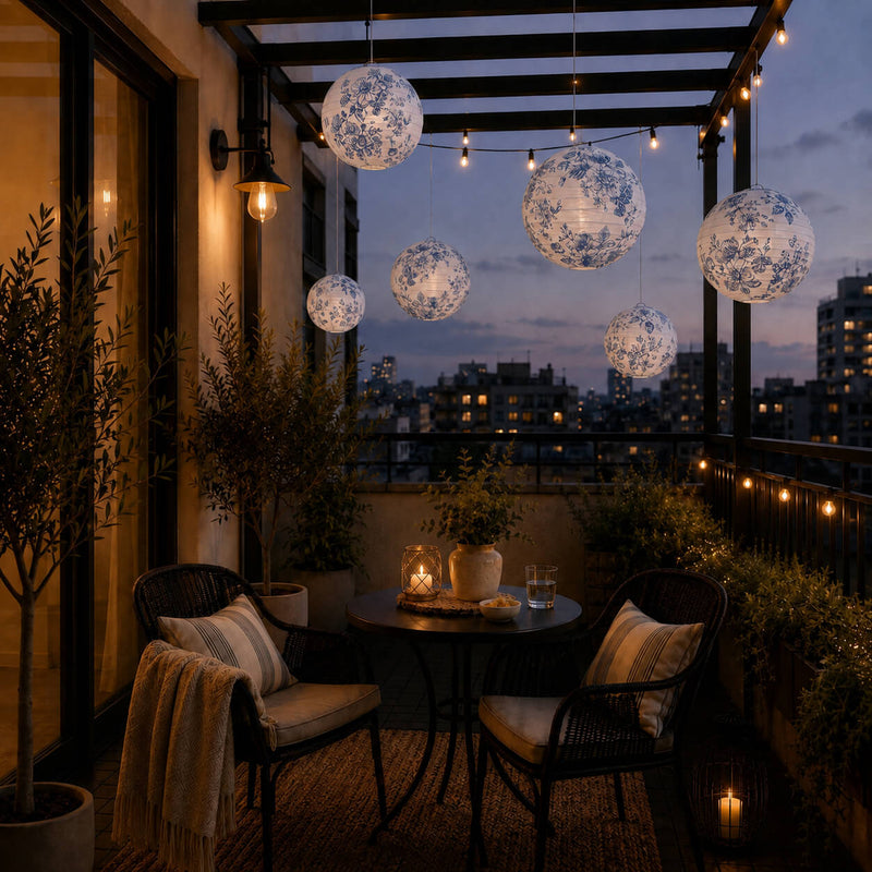 Blue floral paper lanterns hang above a small balcony seating area - thumbnail number 8