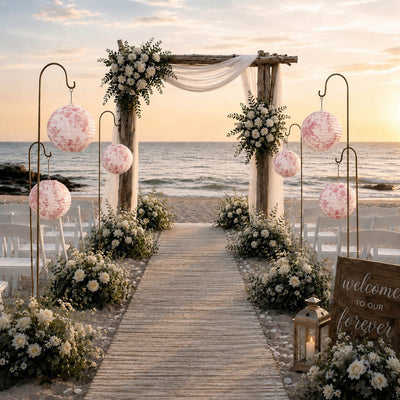 French toile paper lanterns decorate beach wedding arch aisle - thumbnail number 4