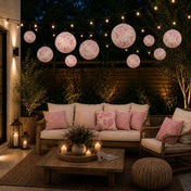 Pink floral French toile paper lanterns hanging over an evening patio - thumbnail number 9
