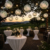 Green floral paper lanterns hang over an outdoor winery cocktail event - thumbnail number 7