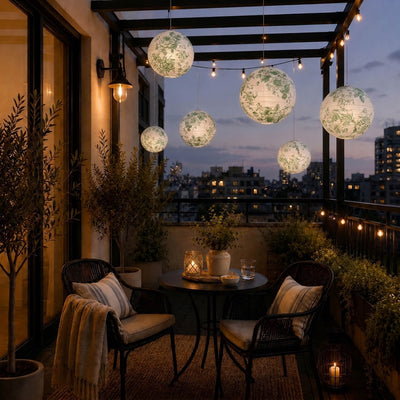 Green floral paper lanterns hang above a small balcony seating area - thumbnail number 8