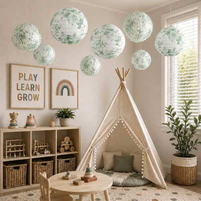 Green floral paper lanterns hang above a kids room with a teepee - thumbnail number 10