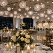 Blue and white French toile paper lanterns hanging over an indoor wedding reception - thumbnail number 3
