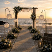 Blue and white paper lanterns hanging on hooks at beach wedding - thumbnail number 4