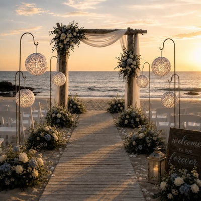 Blue and white paper lanterns hanging on hooks at beach wedding - thumbnail number 4