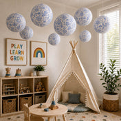 Blue and white French toile paper lanterns hanging over a children's playroom setup - thumbnail number 10