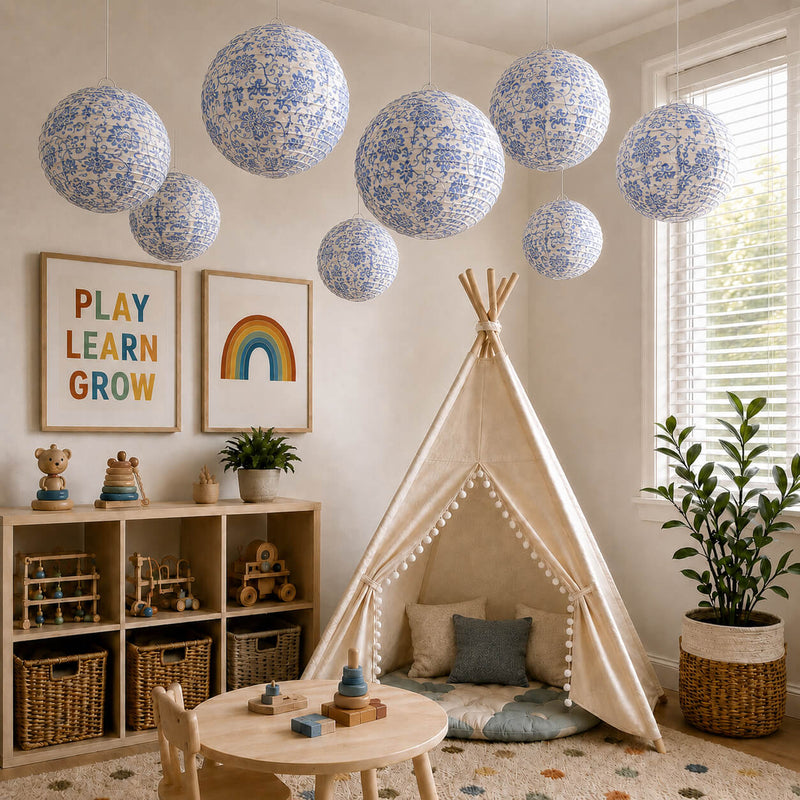 Blue and white French toile paper lanterns hanging over a children's playroom setup - thumbnail number 10