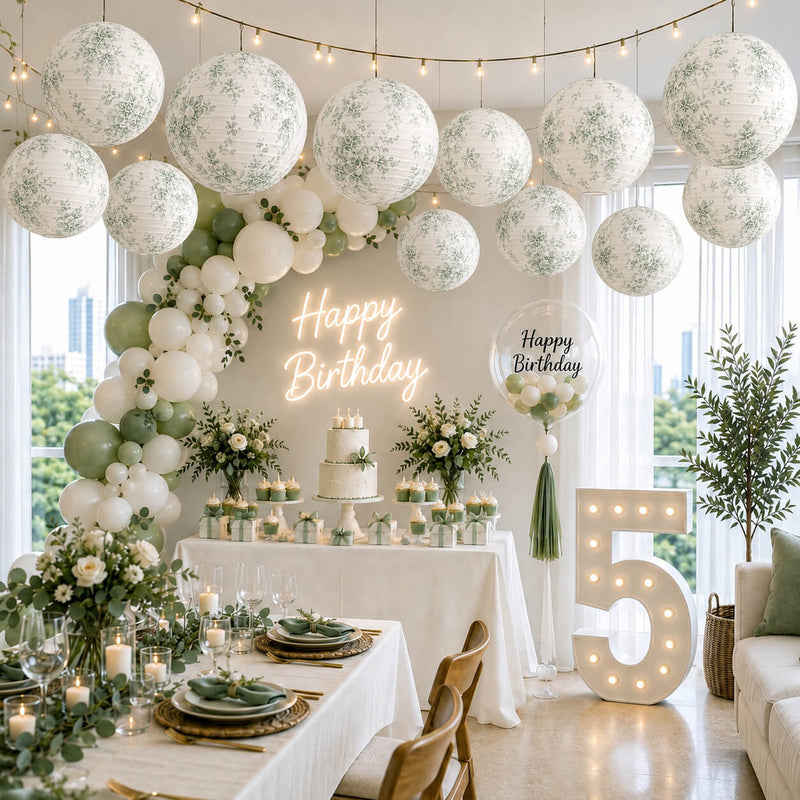 White and green toile paper lanterns hanging over a birthday party setup - thumbnail number 2