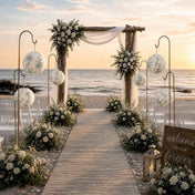 White and green toile paper lanterns on gold rods along a beach wedding aisle - thumbnail number 4
