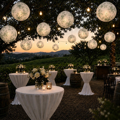 White and green toile paper lanterns hanging outdoors at dusk - thumbnail number 6