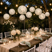 White and green toile paper lanterns hanging over an outdoor dinner table - thumbnail number 7