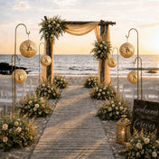Gold sequin lanterns hanging on stands along a beach wedding aisle - thumbnail number 4