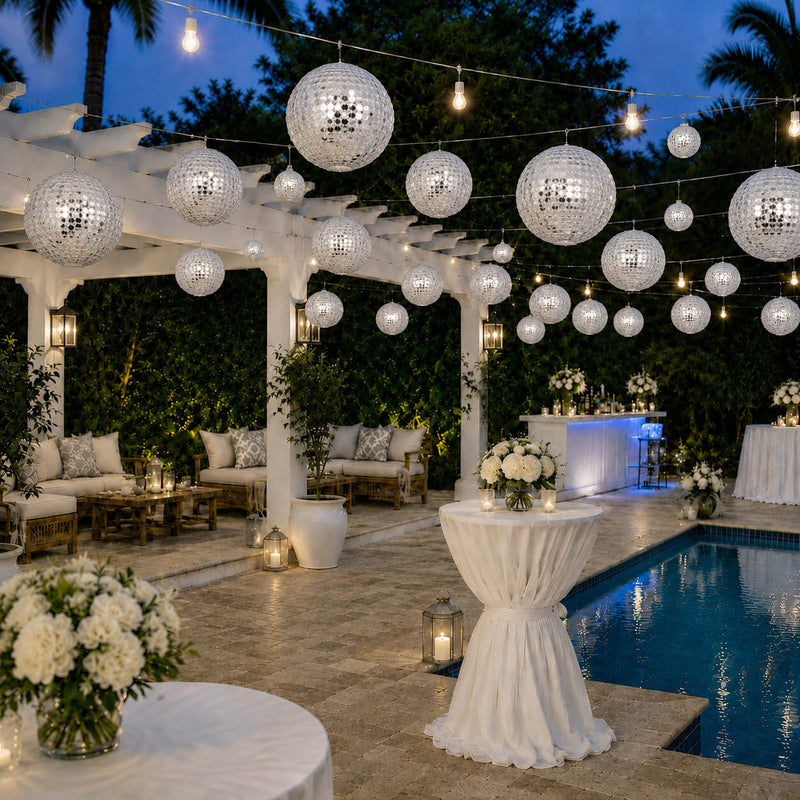 Hanging silver payette sequin lanterns glowing over a poolside party - thumbnail number 7