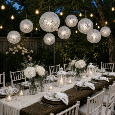 Hanging silver payette sequin lanterns over an outdoor garden dinner party - thumbnail number 4