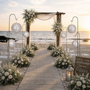 Silver sequin paper lanterns on gold rods along a beach wedding aisle - thumbnail number 3