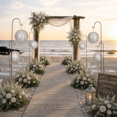 Silver sequin paper lanterns on gold rods along a beach wedding aisle - thumbnail number 3