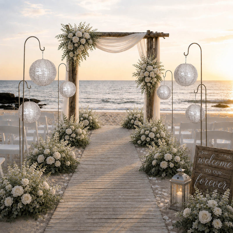 Silver sequin paper lanterns on gold rods along a beach wedding aisle - thumbnail number 3