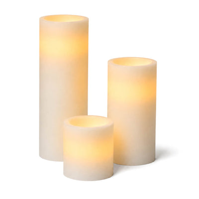 Assorted glowing white LED pillar candles on a white background - thumbnail number 2