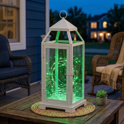 White lantern filled with 20 LED green micro fairy string lights on an outdoor patio table - thumbnail number 9