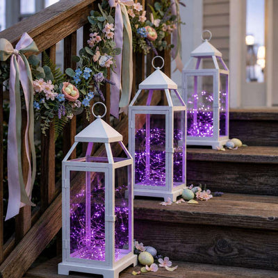 White lanterns filled with purple LED fairy lights decorated on wooden stairs for Easter - thumbnail number 7
