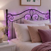 Purple LED fairy lights draped around a black metal headboard in a bedroom - thumbnail number 8
