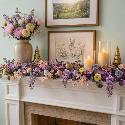 Purple LED fairy lights woven into an Easter mantel garland with flowers and candles - thumbnail number 9