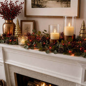 Red LED fairy lights woven into a mantel garland with pinecones, berries, and pillar candles - thumbnail number 10