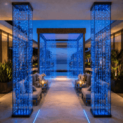 Blue LED curtain lights decorating an elegant outdoor patio lounge - thumbnail number 7