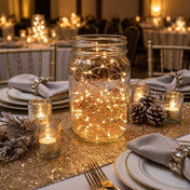 Mason jar filled with warm LED fairy string lights as a centerpiece on a wedding table - thumbnail number 5
