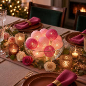 Glowing pink and fuchsia cotton ball lights inside a glass bowl as a table centerpiece - thumbnail number 4