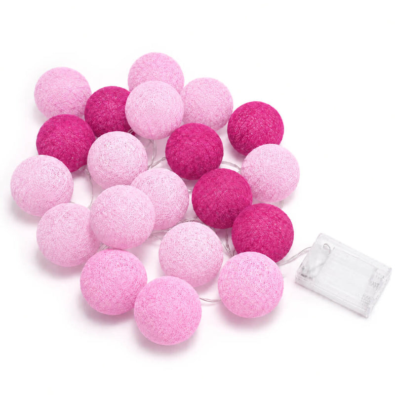 Pink and fuchsia cotton ball LED string lights with a clear battery pack on a white background - thumbnail number 1