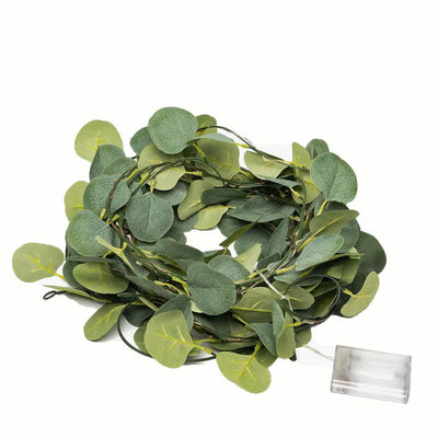 Coiled green eucalyptus leaf garland string lights with a battery box - thumbnail number 1