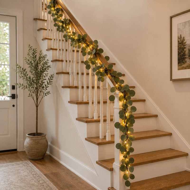 A 7ft battery-operated eucalyptus garland with 20 warm white LED lights on a staircase railing - thumbnail number 8