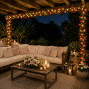 A 7ft red silk rose flower garland with 20 LED string lights draped over an outdoor patio structure - thumbnail number 6