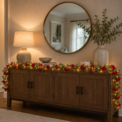 A 7ft red silk rose flower garland with 20 LED string lights draped on a wooden console table - thumbnail number 7