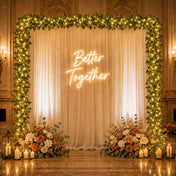 Ivy garland string lights framing a wedding backdrop with a neon sign - thumbnail number 6
