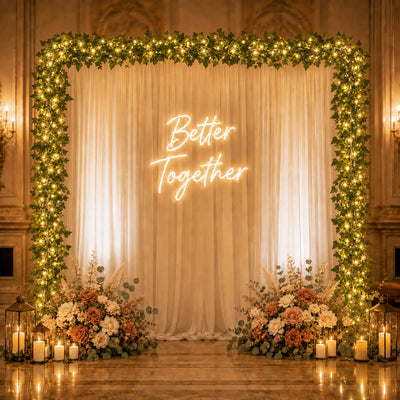 Ivy garland string lights framing a wedding backdrop with a neon sign - thumbnail number 6