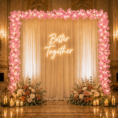 Pink cherry blossom LED garland framing wedding backdrop - thumbnail number 5