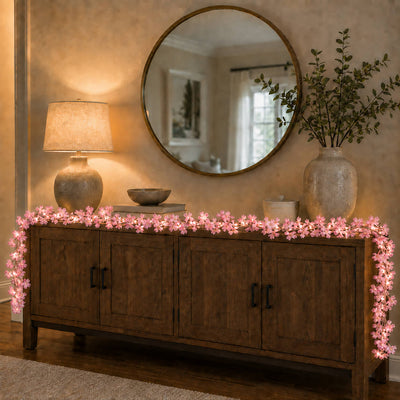 Pink cherry blossom LED garland decorating a wooden sideboard - thumbnail number 9