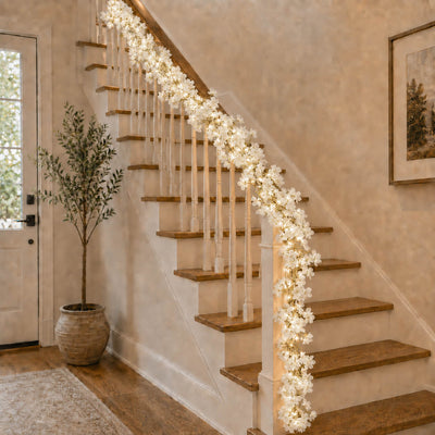 Cherry blossom garland string lights draped along a staircase handrail - thumbnail number 8