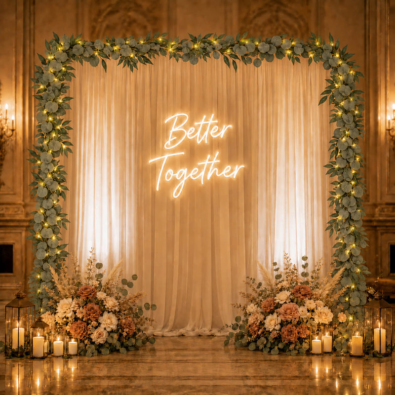 Eucalyptus LED garland frames a backdrop with a neon sign - thumbnail number 5