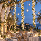 White jasmine flower garlands with fairy lights hanging vertically outdoors - thumbnail number 5