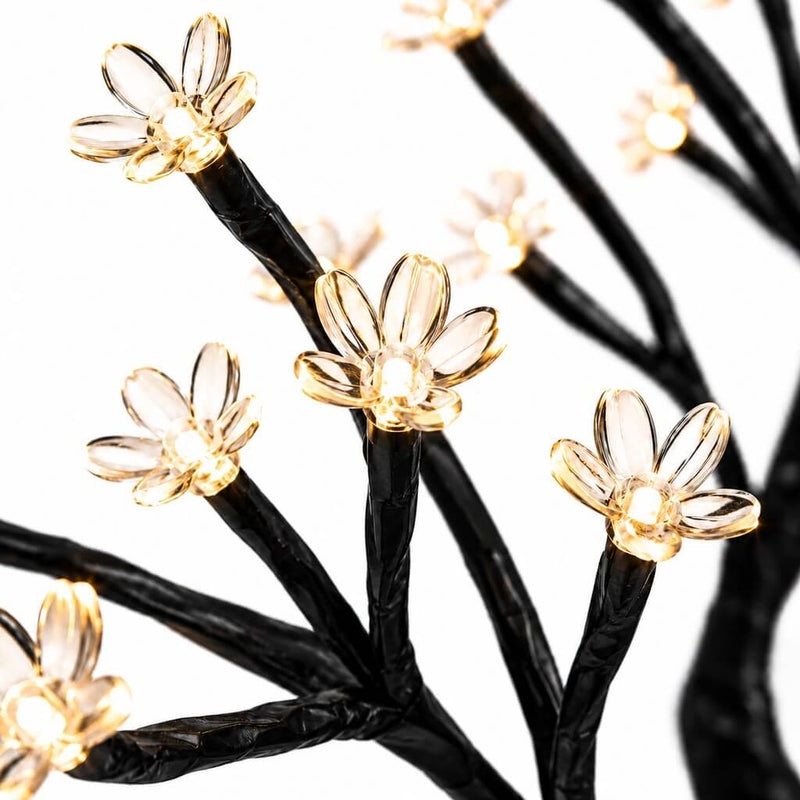 Close-up of black branches with glowing warm white LED cherry blossom flowers - thumbnail number 3