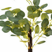 Close-up of artificial eucalyptus branches wrapped with warm white LED fairy lights - thumbnail number 3