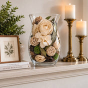 Glass vase filled with dried potpourri flowers on a mantelpiece - thumbnail number 8
